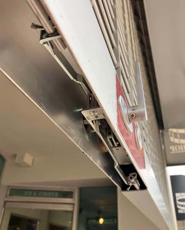 commercial roll-down security gate lock installation.