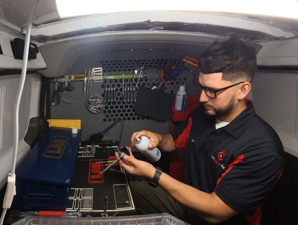 lubricating a car door lock as part of the cardoor lock repair process