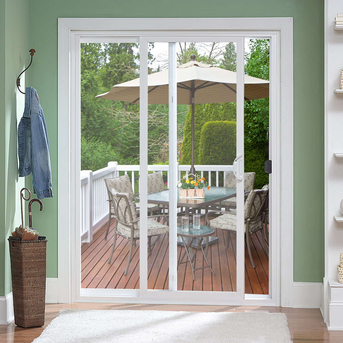 A set of two glass patio sliding doors looking out onto a patio deck.